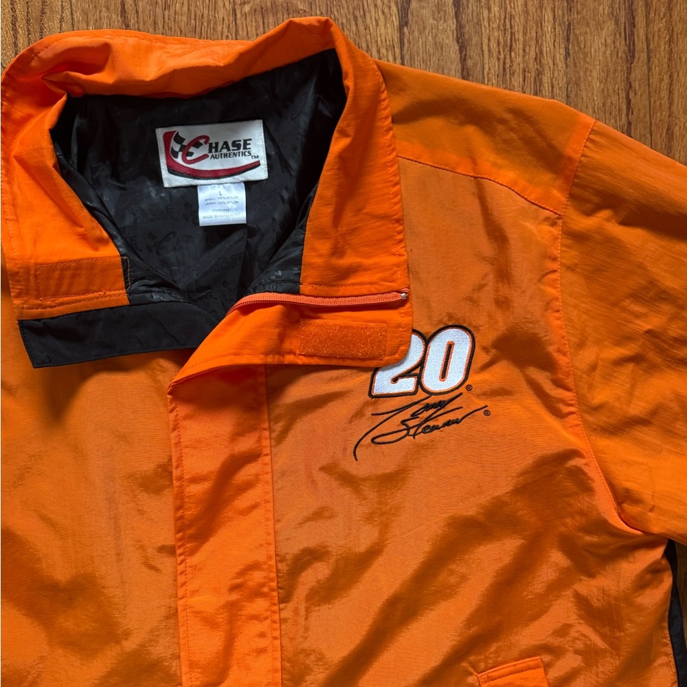 Orange and black Terry Stewart NASCAR jacket nascar. SIZED as L but fits like XL
